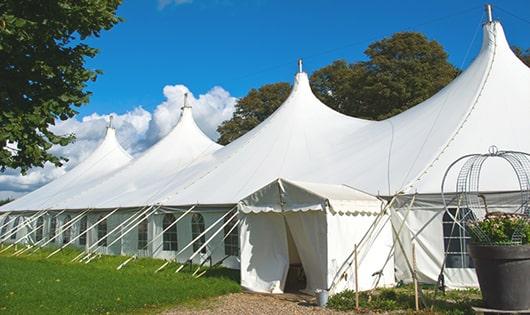 a row of portable restrooms placed outdoors for attendees of a special event in Eden